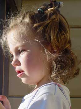 aly watching birds from the balcony